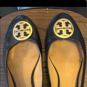 Size 12 Tory Burch black flats with classic gold logo.